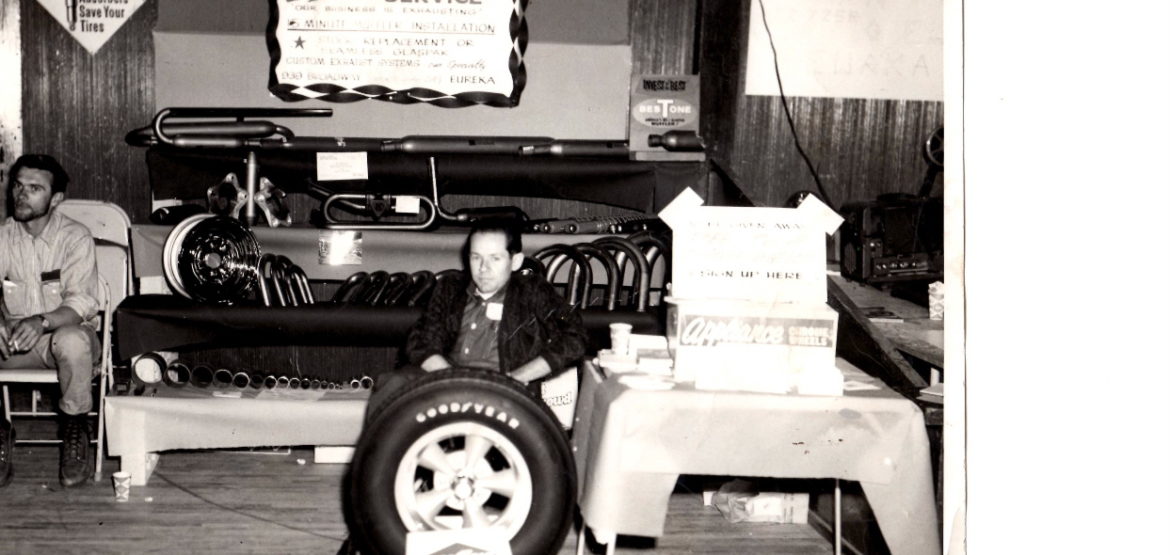 Black and white photo of 2 men at a car show - Leon's Car Care Center